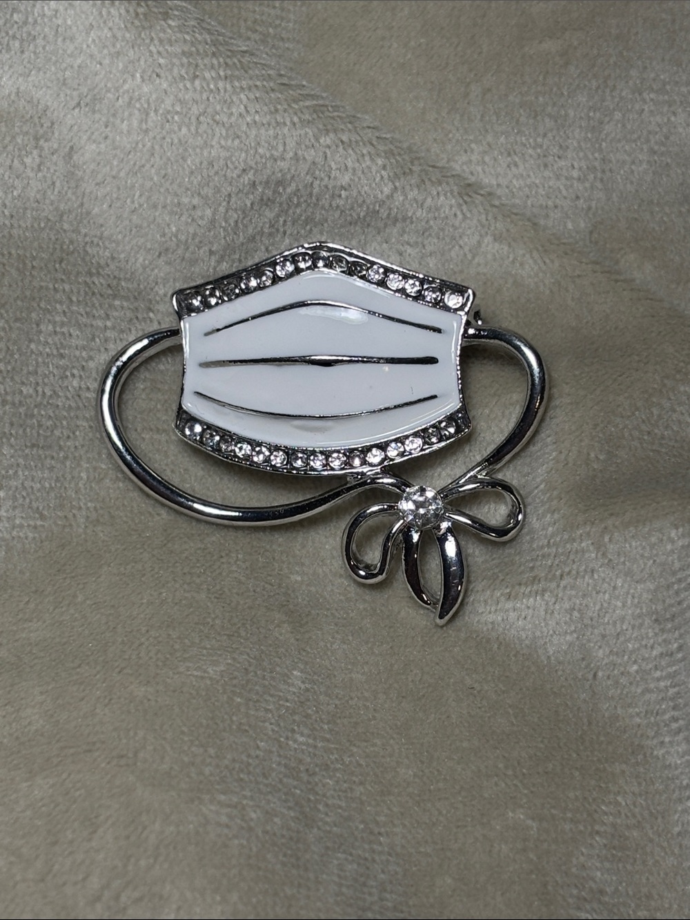Elegant White Enamel and Silver Mask Brooch with Crystal Accents
